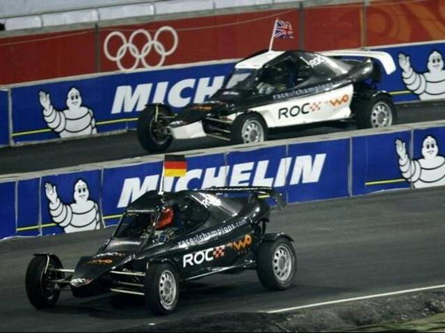 Team Germany's Michael Schumacher drives ahead of team Britain's Jenson Button