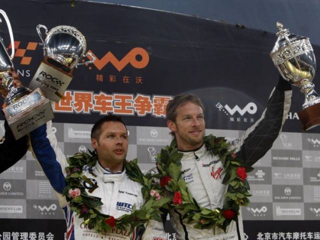 Team Britain's Jenson Button and Andy Priaulx hold up the Nations Cup. after winning the second place