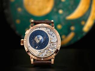 The orbital moon-phase display of this timepiece is calculated with such accuracy that it takes 1,058 years to deviate by one day