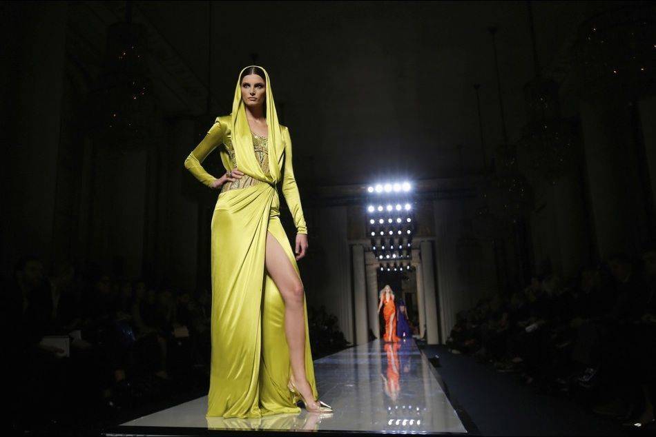 Reviving the look iconicized by Grace Jones in the 1980s, Donatella Versace channels the "contemporary goddess" in her showcase at Haute Couture Week in Paris