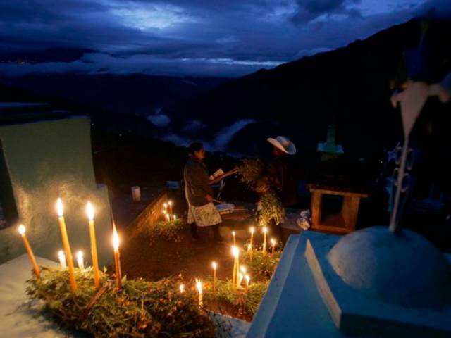 Mexicans pay homage to their dead relatives by preparing meals and decorating their graves