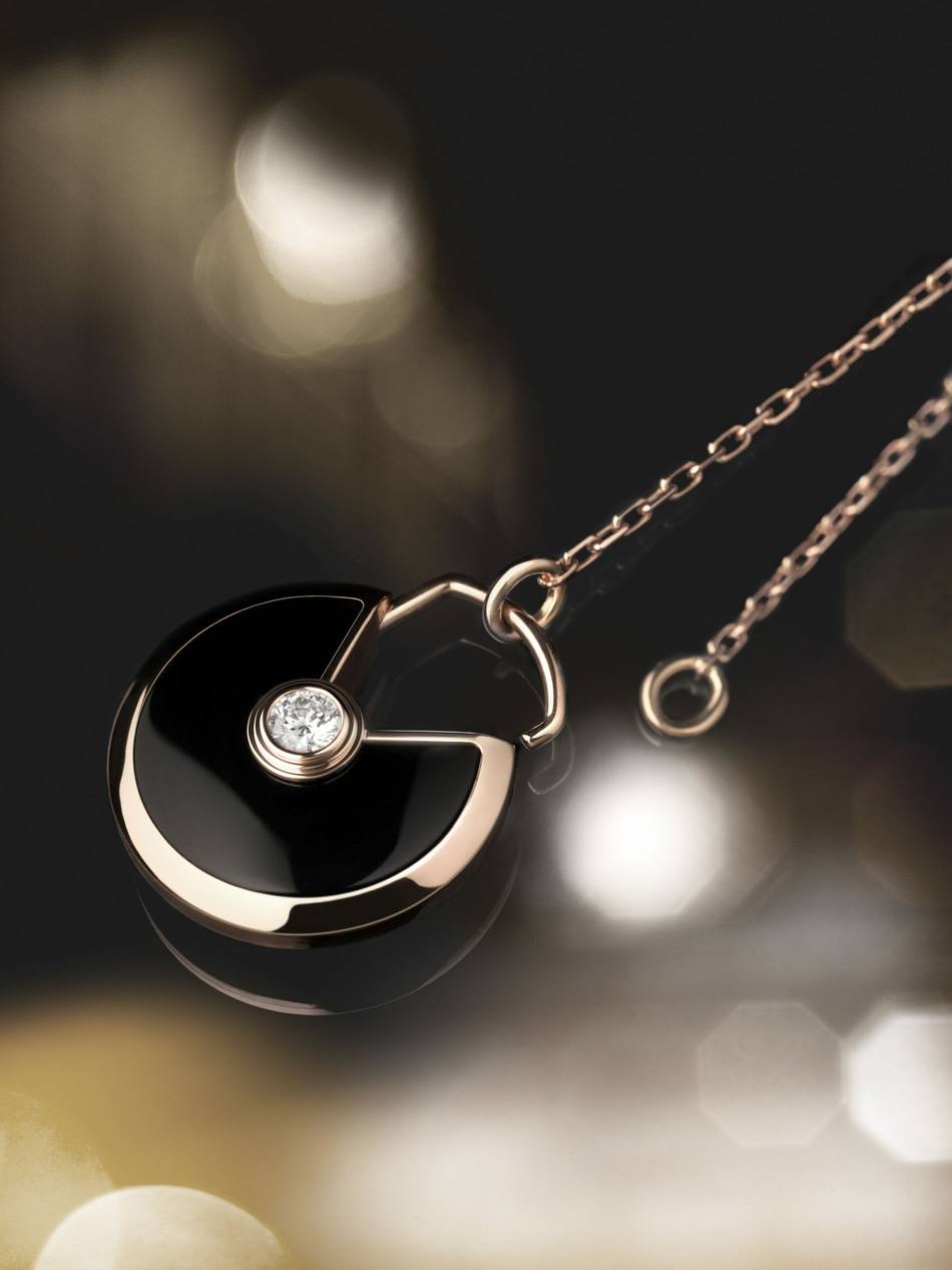The new pendant necklace and miniature bracelet collection from Cartier features an amulet that has the appeal of a personal charm and talisman