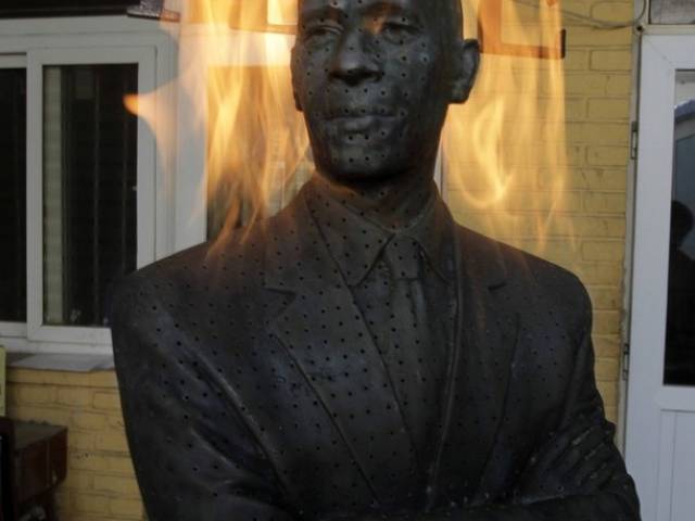 A sculpture by Chinese artist Liu Bolin titled "Burning Man Obama". Photo Credit: AP