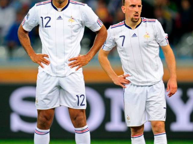 Thierry Henry and Franck Ribery of France stand over the ball
