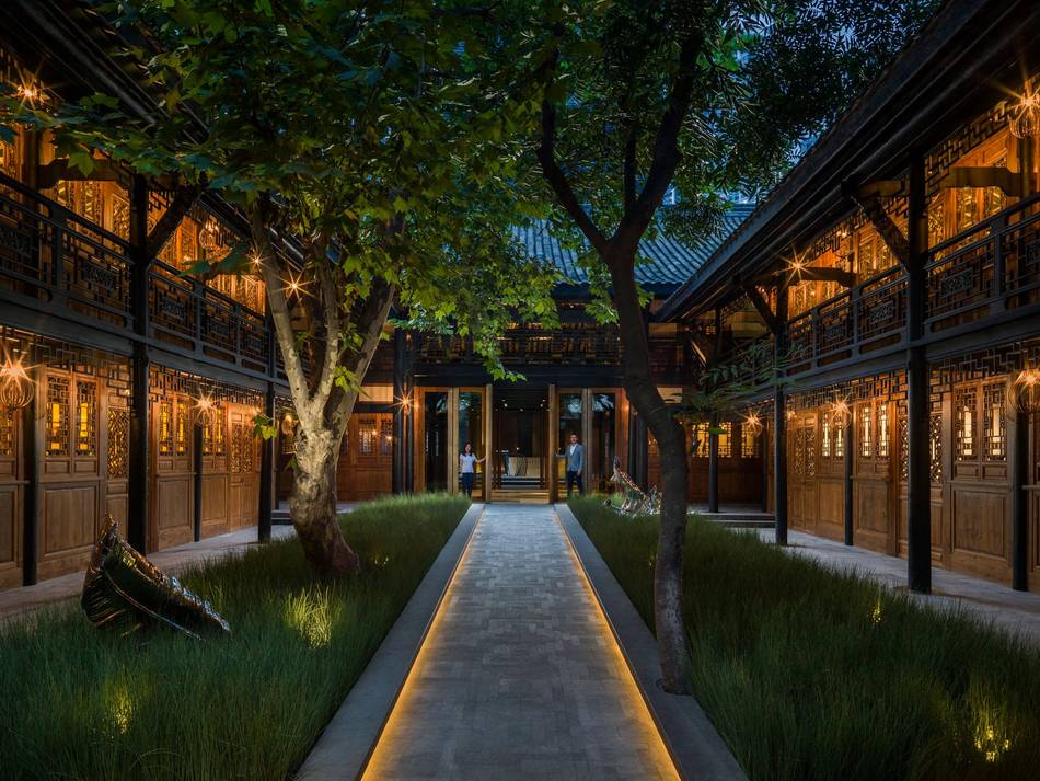 The new hotel is an integral part of the government's conservation project to preserve the surrounding traditional courtyards next to the thousand-year-old Daci Temple