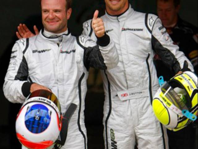 Jenson BUTTON and Rubens Barrichello, his closest rival to the championship this year