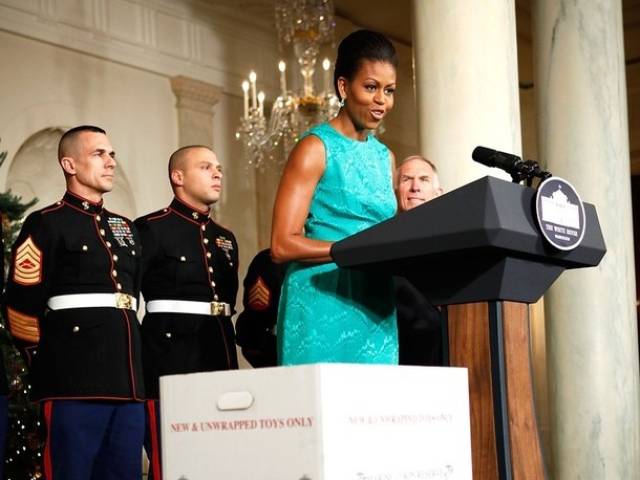 Michelle Obama in a turquoise dress at a recent Toys for Tots event
