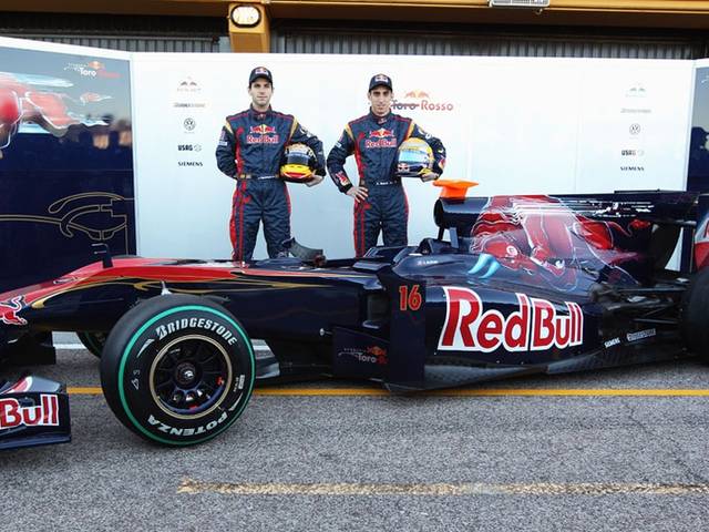 Sebastian Buemi and Jaime Alguersuari pose with the new STR5 from Scuderia Toro Rosso