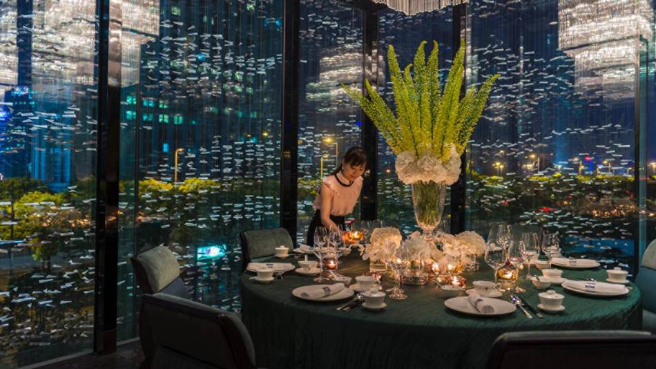 Four Seasons Hotel Pudong rises above the urban melee of Shanghai with art-filled interiors that are inspired by city's Golden Age during the 1920s and 30s Art Deco period