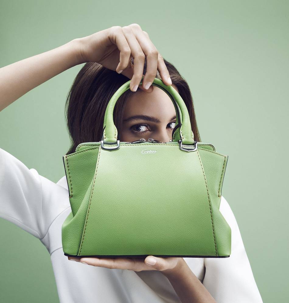 An XS version of the C de Cartier bag this season channels a baby-doll style in sharp, bright tones