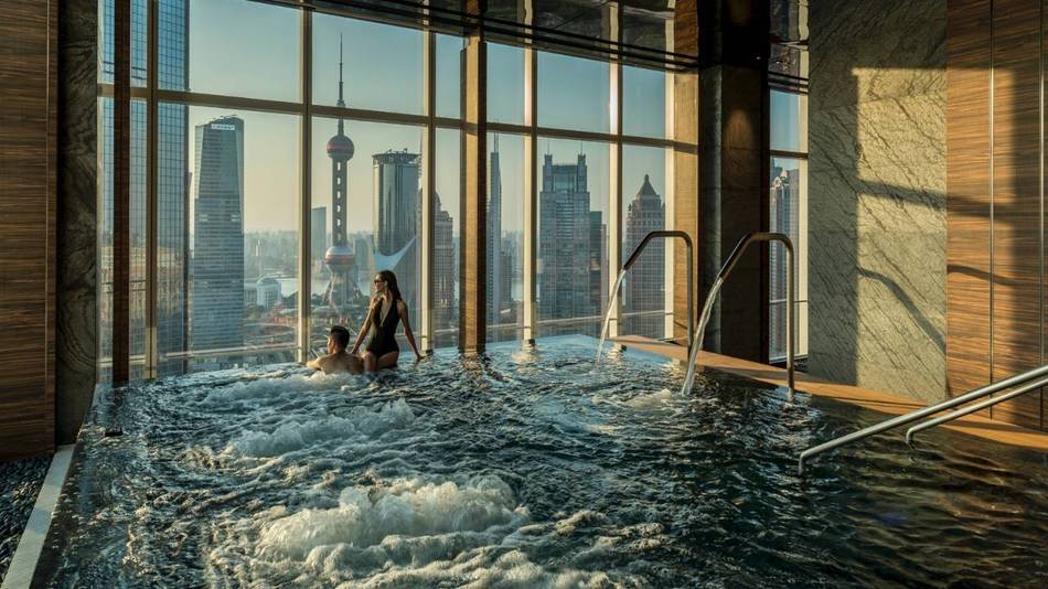 Four Seasons Hotel Pudong rises above the urban melee of Shanghai with art-filled interiors that are inspired by city's Golden Age during the 1920s and 30s Art Deco period
