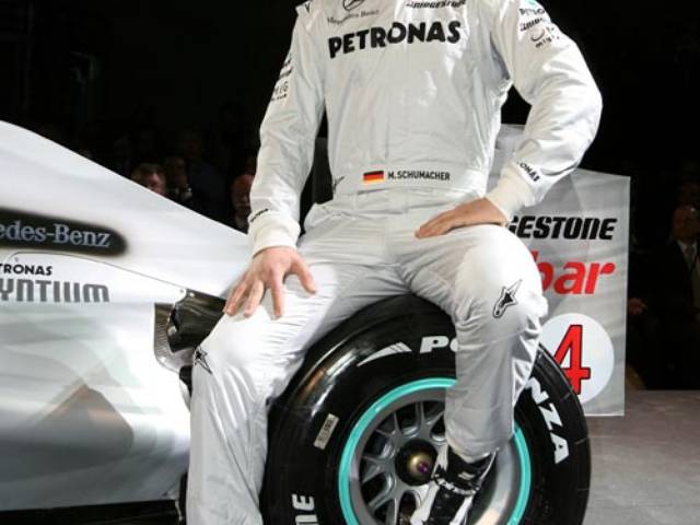 Michael Schumacher poses for a photo during the team presentation at Mercedes Museum