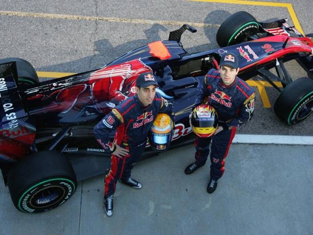 Sebastian Buemi and Jaime Alguersuari pose with the new STR5 from Scuderia Toro Rosso