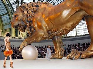 A several story-tall golden lion presided over Chanel's fall/winter 2011 haute couture