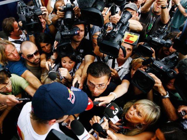 Media frenzy surrounds Vettel after his collision with teammate Webber who was leading