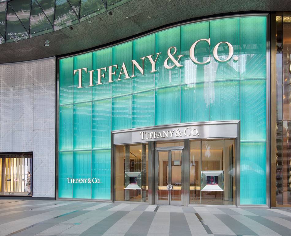 The two-story façade is lit with Tiffany Blue and carved with a wheatleaf pattern similar to that which frames the entrance of Tiffany’s Fifth Avenue flagship store in New York City