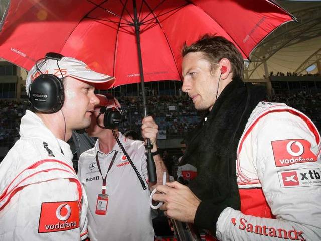 Jenson Button (right) must up his game to challenge McLaren teammate Lewis Hamilton