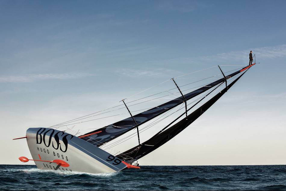 In a daredevil feat, the British yachtsman scales the 60-foot mast of the HUGO BOSS and dives into the ocean wearing a BOSS formal suit
